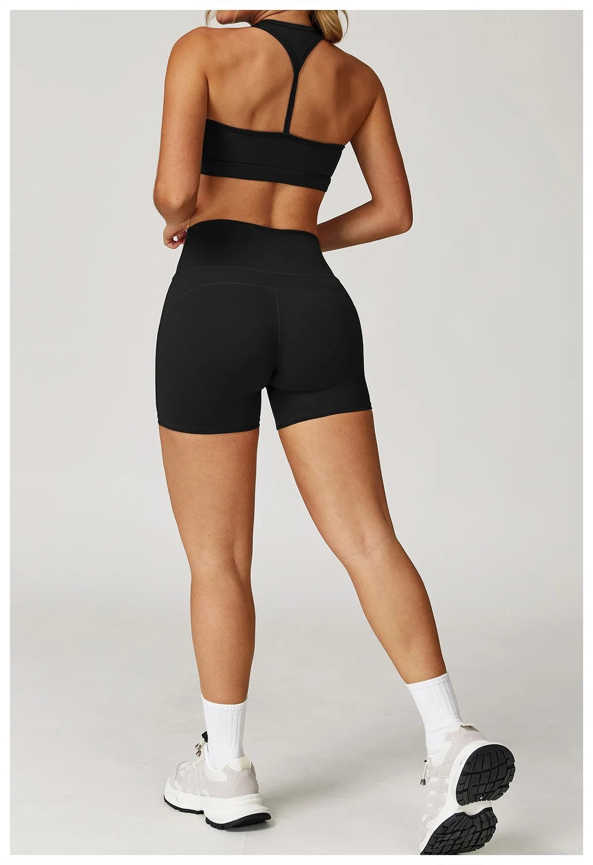 Xooie Fit two-piece set black high-performance activewear with racerback top and fitted shorts