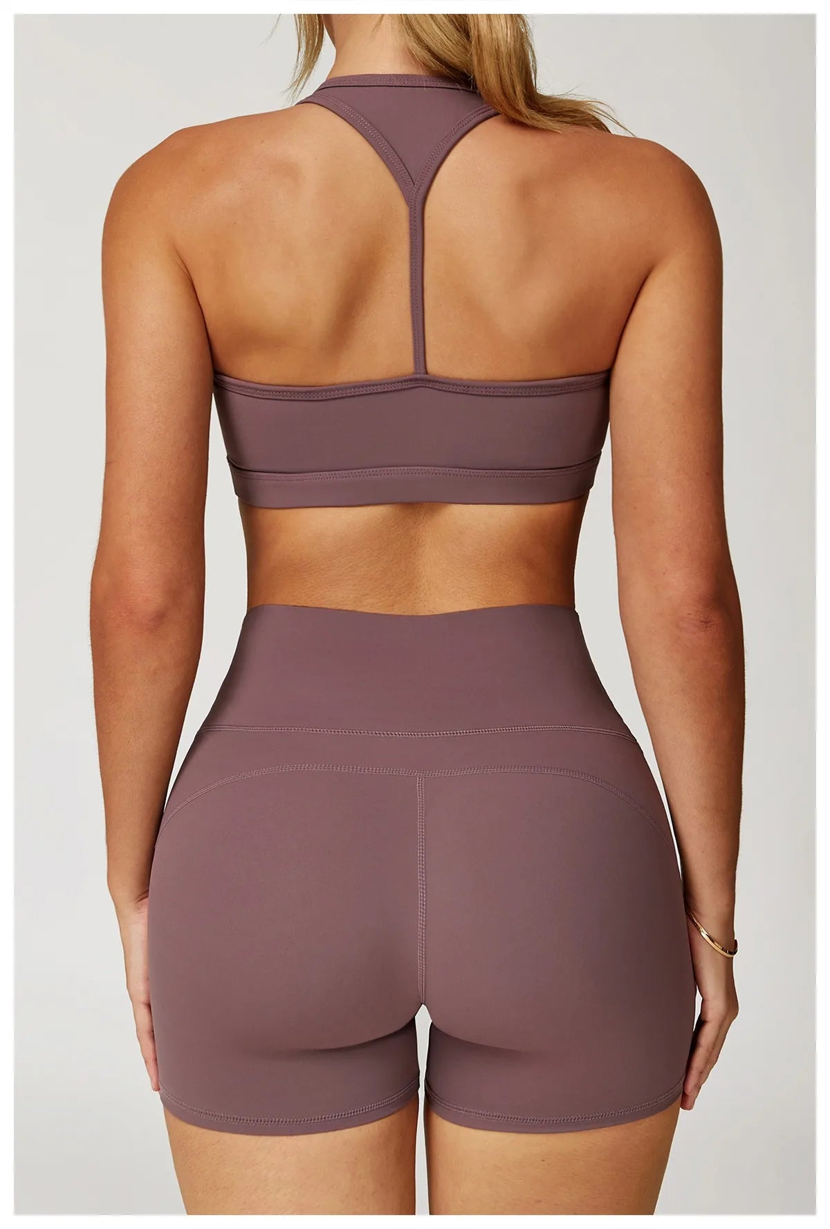Xooie Fit two-piece set in mauve featuring high-performance activewear shorts and racerback sports bra