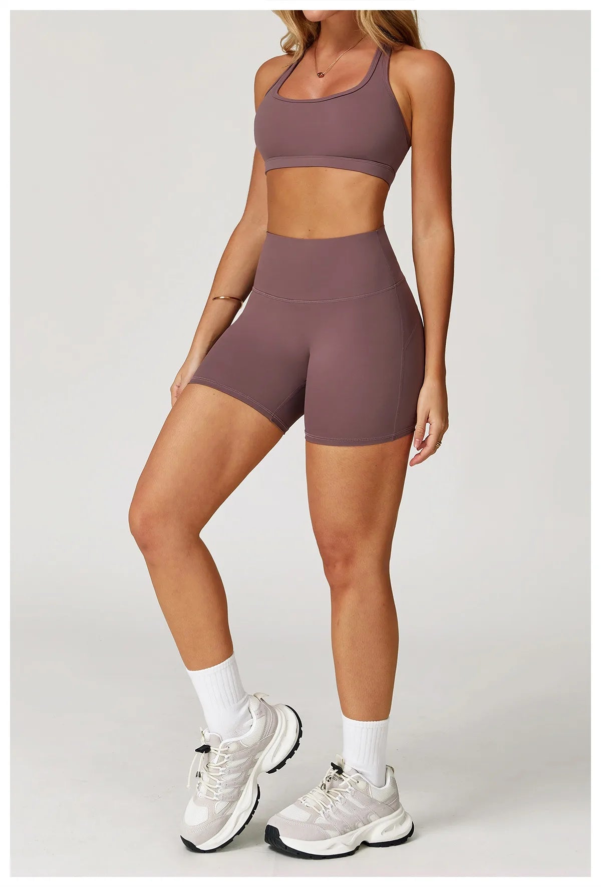 Xooie Fit two-piece set in mauve featuring high-performance activewear bra and shorts