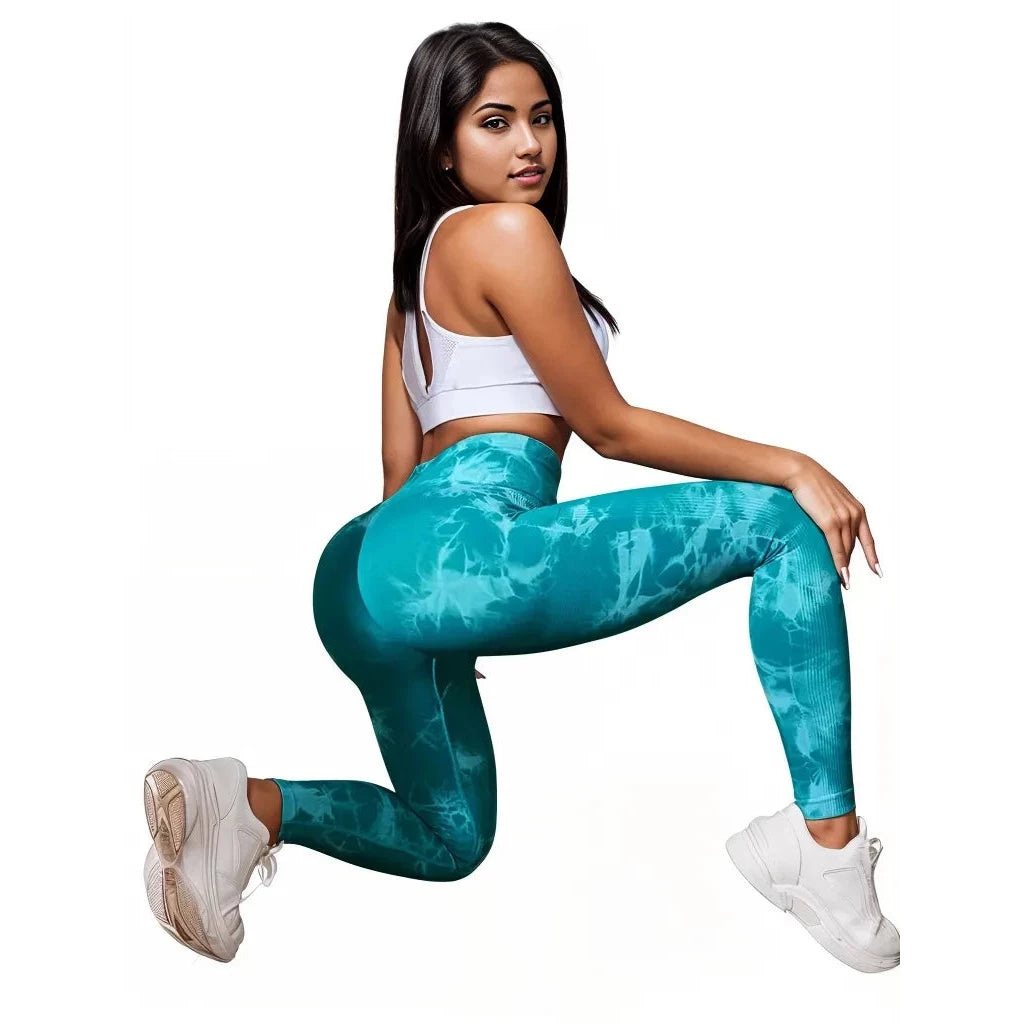 Model wearing Xooie Fit high-performance fitness leggings in teal tie-dye design for active lifestyles