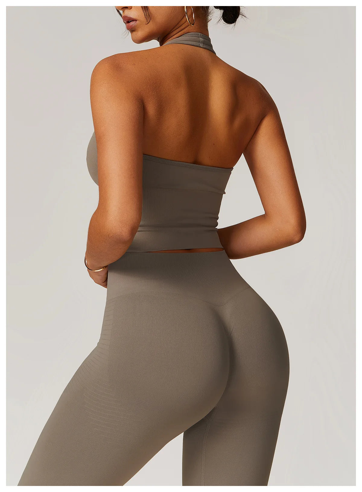 High-waisted active leggings in gray from back view, smooth fabric with contouring