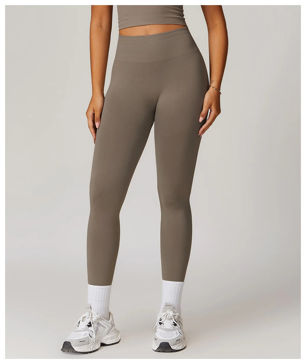 High-waisted active leggings in light gray, ankle-length fit with supportive stretch
