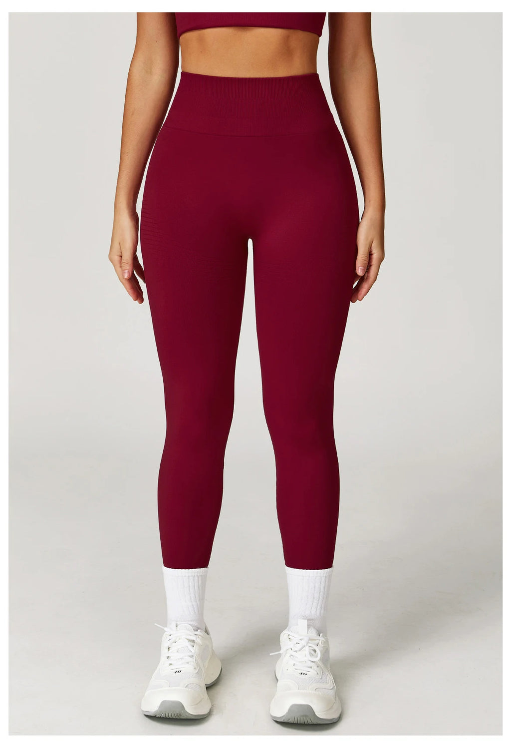 Cherry red high-waisted active leggings with tapered ankle-length legs