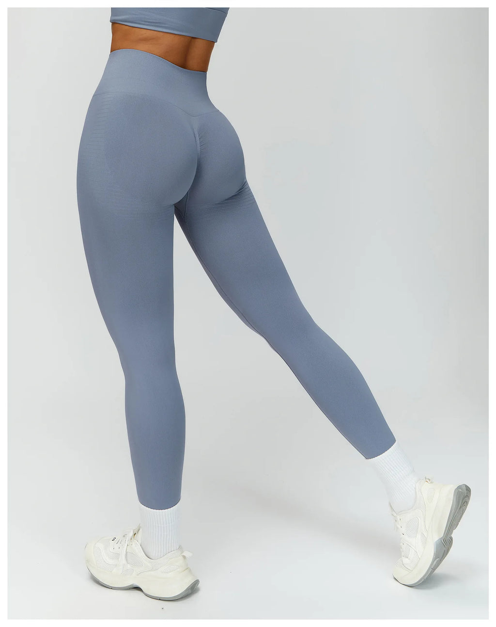 Sea blue high-waisted active leggings viewed from the side, smooth stretch fit