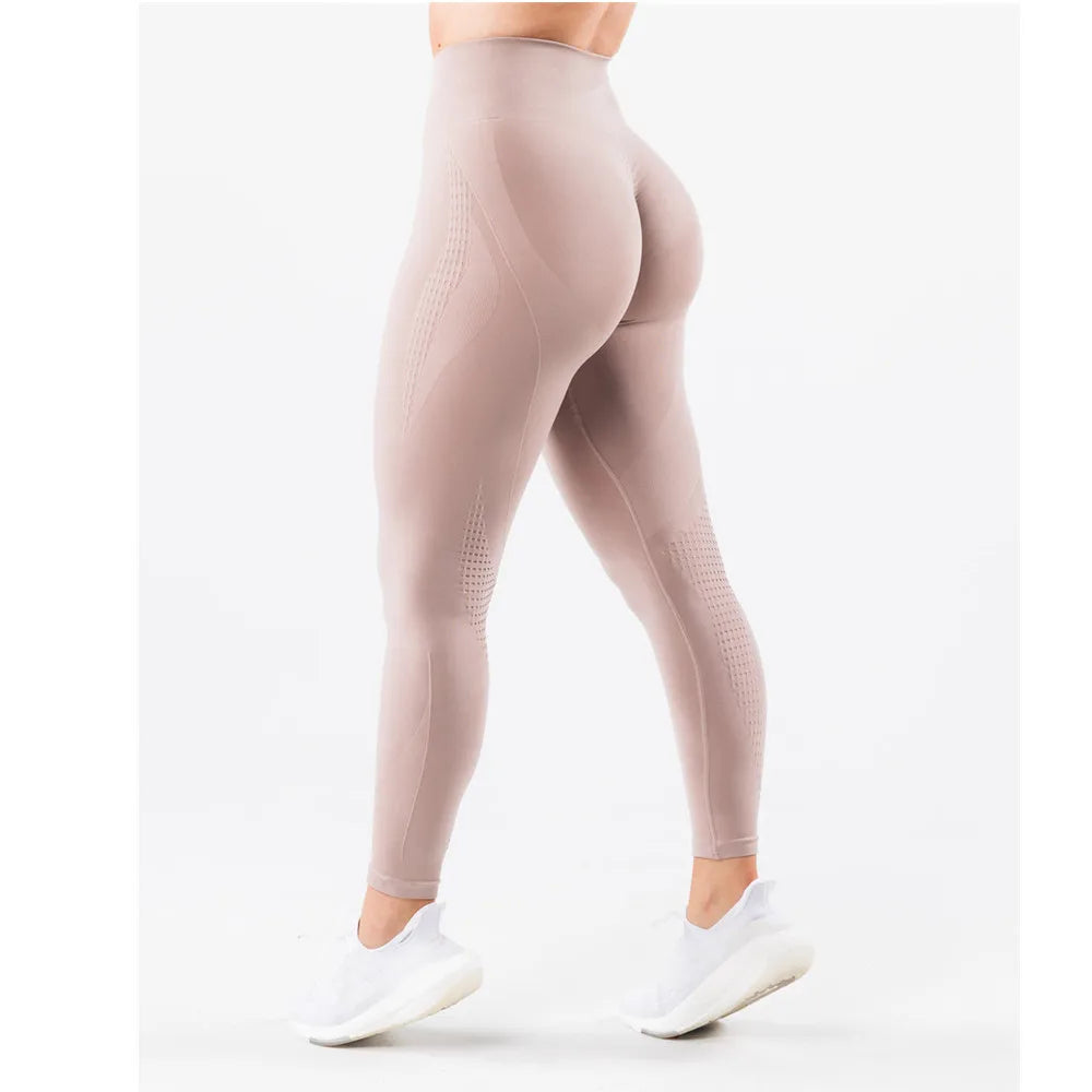 Xooie Fit high waisted active leggings in light beige, designed for comfort and style during workouts.