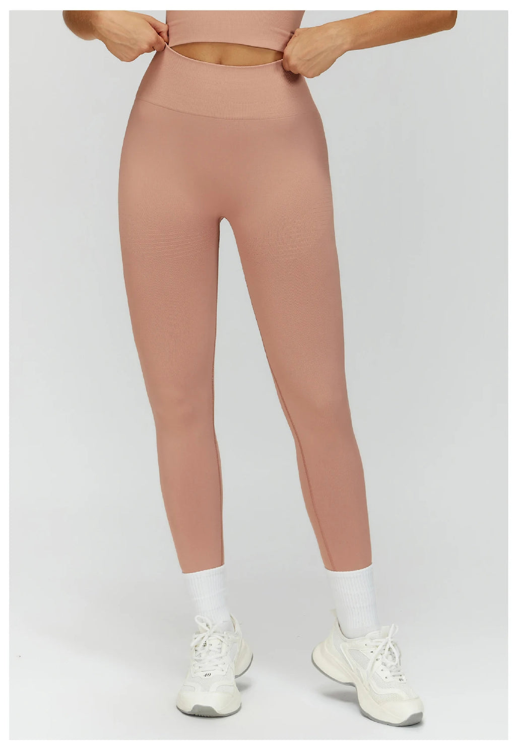 High-waisted active leggings in light pink, full length with tapered leg