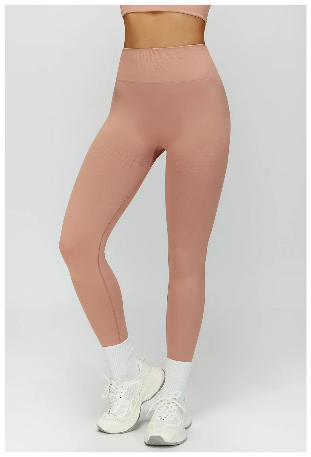 Peach pink high-waisted active leggings, full front view and contoured seams