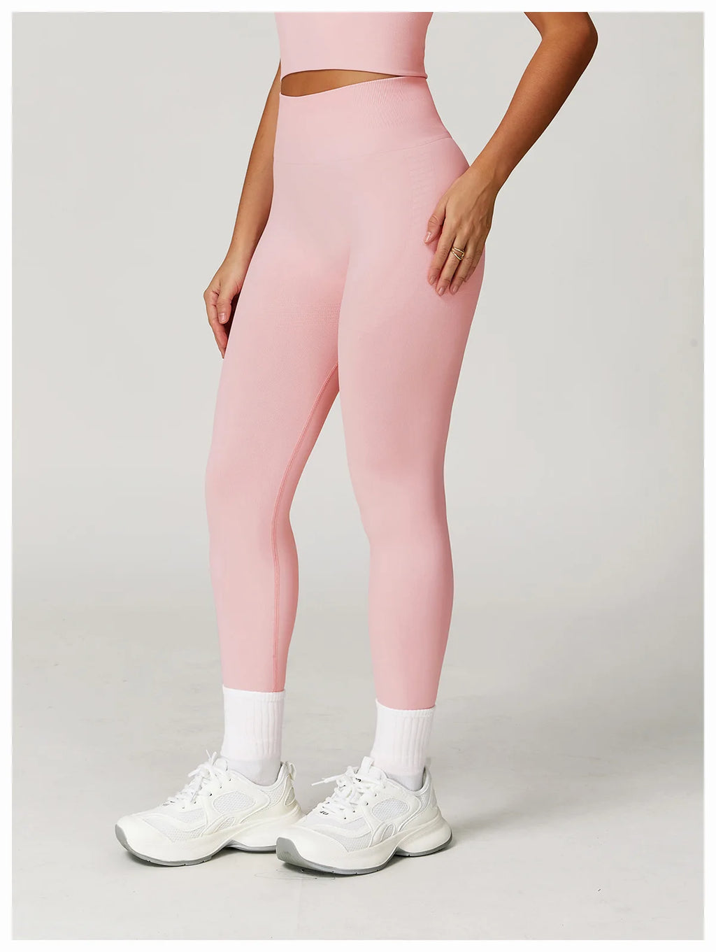 Light pink high-waisted active leggings, side view with clean, flat leg seams
