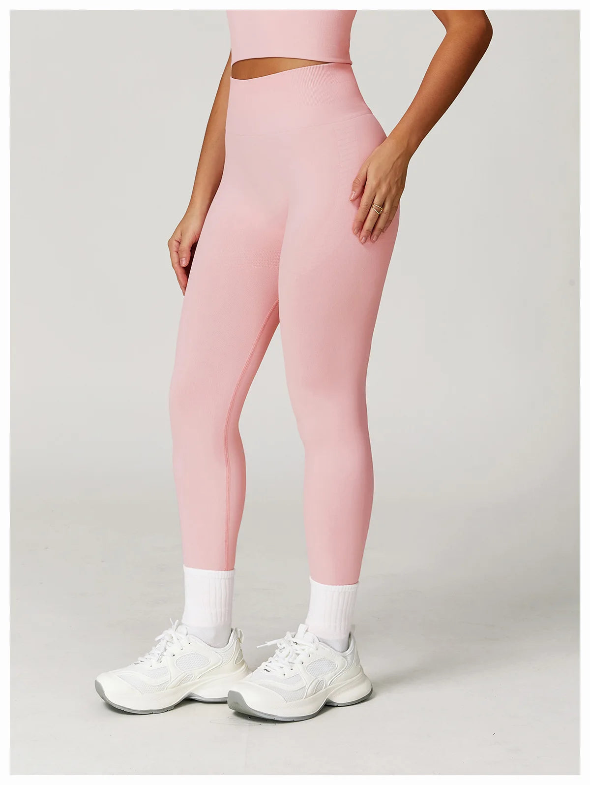 Light pink high-waisted active leggings, side view with clean, flat leg seams