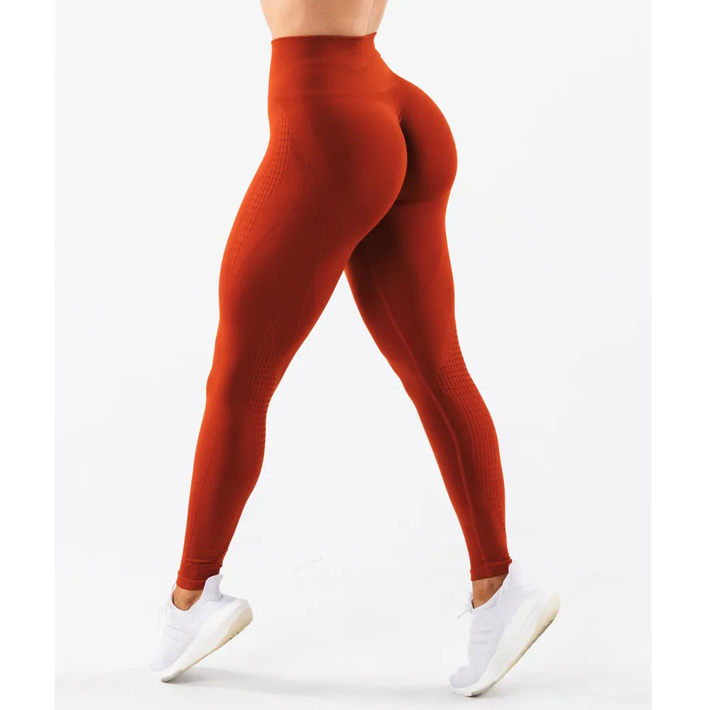 Xooie Fit high waisted active leggings in burnt orange, perfect for workouts with a flattering fit