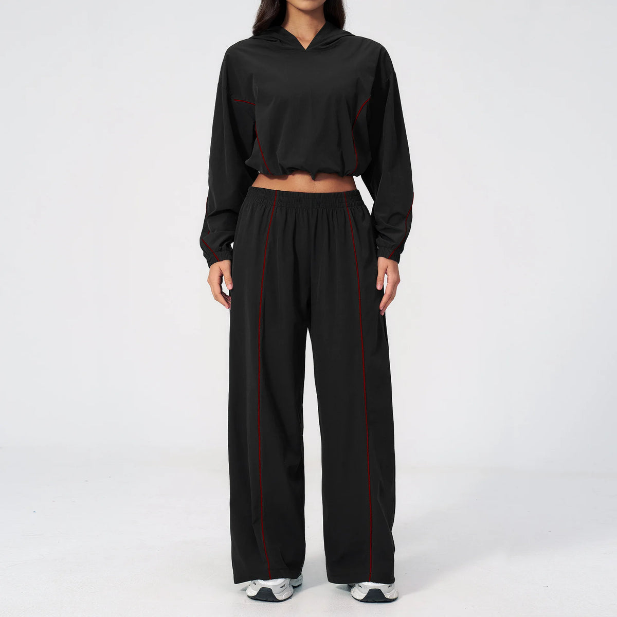 Women’s black hooded sports set with red piping, cropped jacket and wide-leg pants
