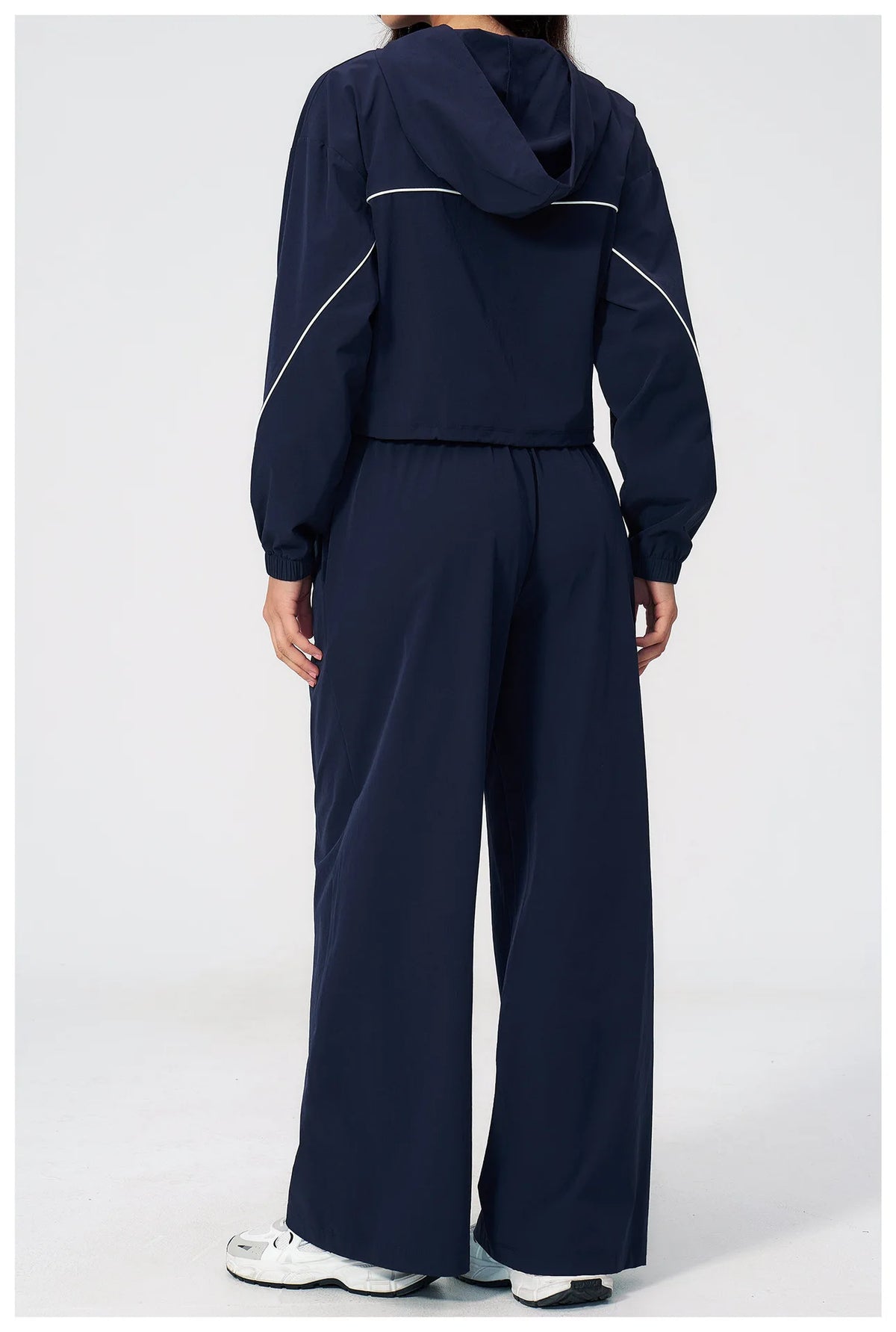 Women’s hooded zip sports set with long sleeves and wide-leg pants, navy blue, back view