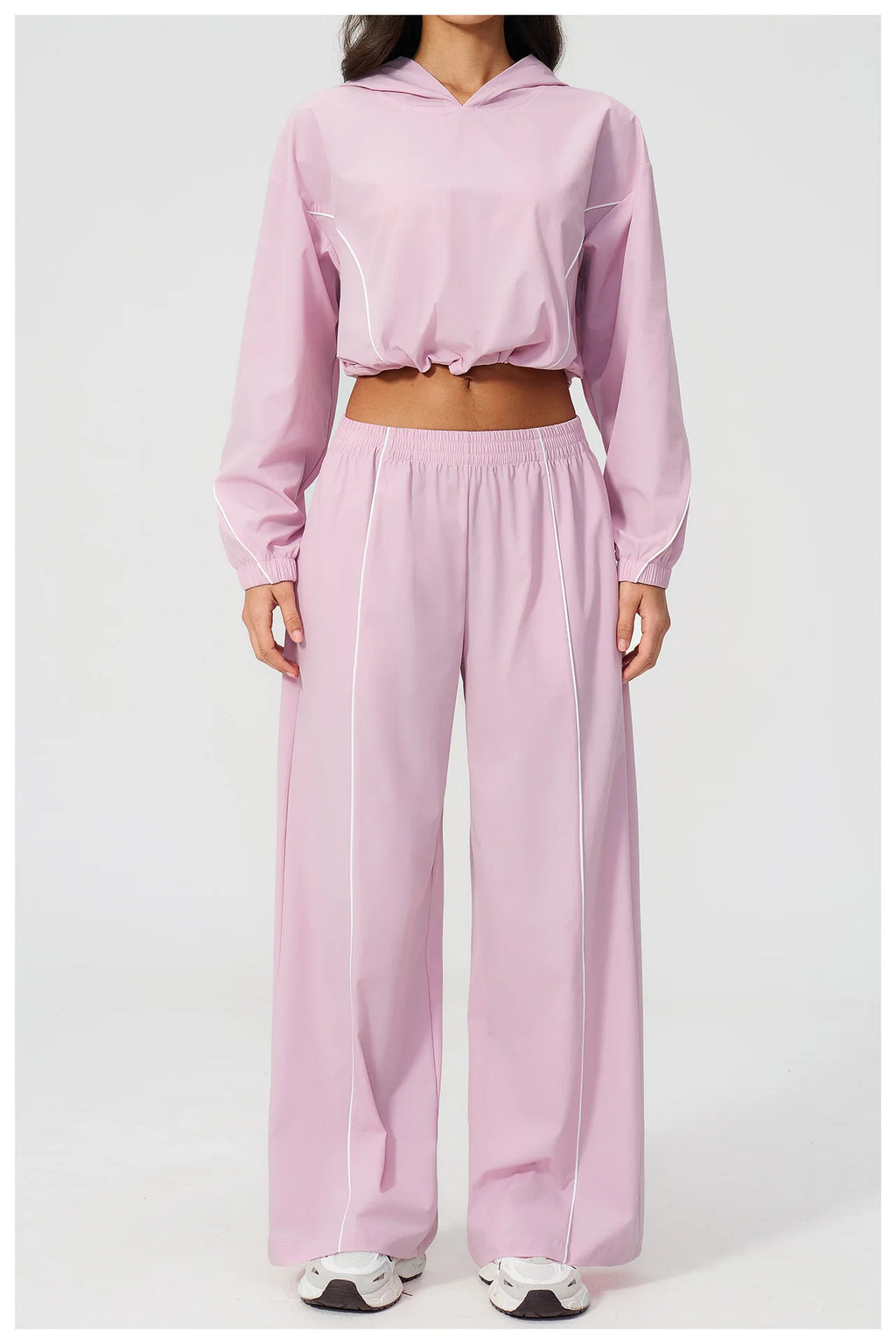 Women’s hooded zip sports set with long sleeves and wide-leg pants, pale pink, front view
