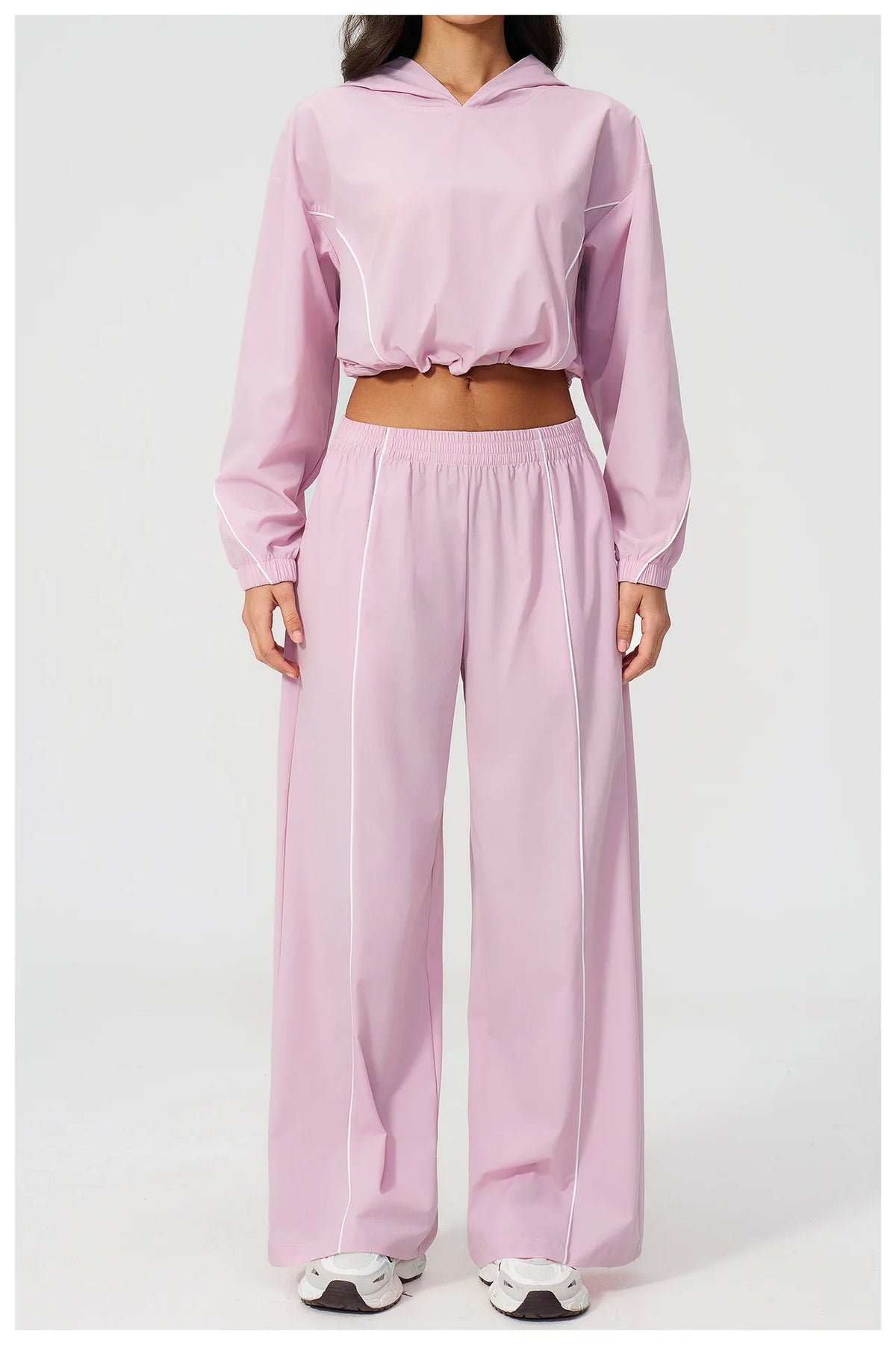 Women’s hooded zip sports set with long sleeves and wide-leg pants, pale pink, front view