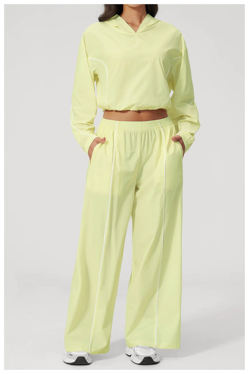 Women’s lemon yellow hooded sports windbreaker and wide-leg pants set, cropped top