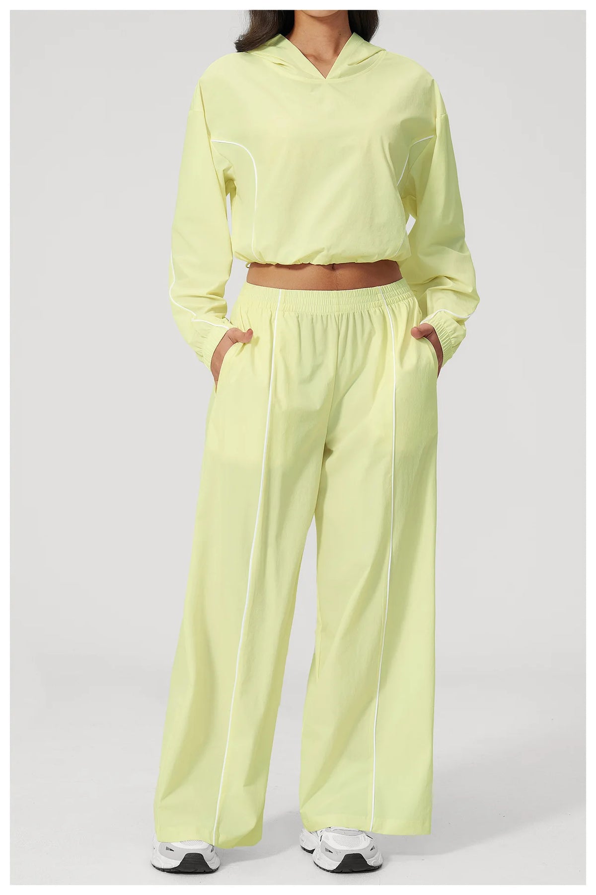 Women’s lemon yellow hooded sports windbreaker and wide-leg pants set, cropped top