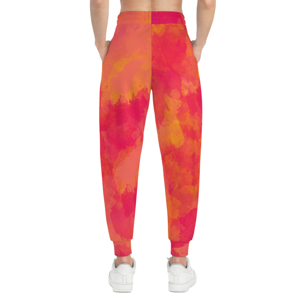 Pink-orange tie-dye joggers, back view with elastic waistband and ankle cuffs