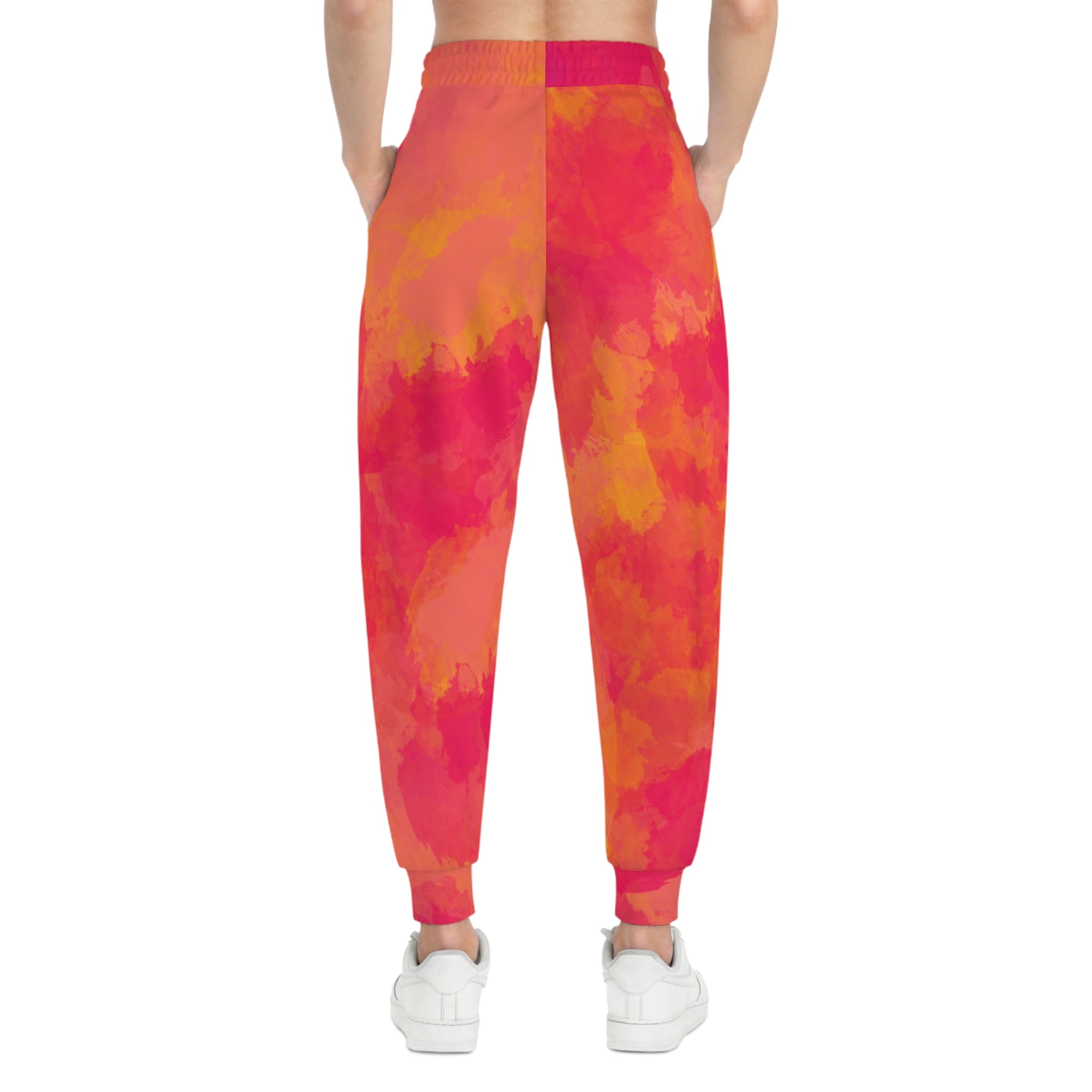 Pink-orange tie-dye joggers, back view with elastic waistband and ankle cuffs