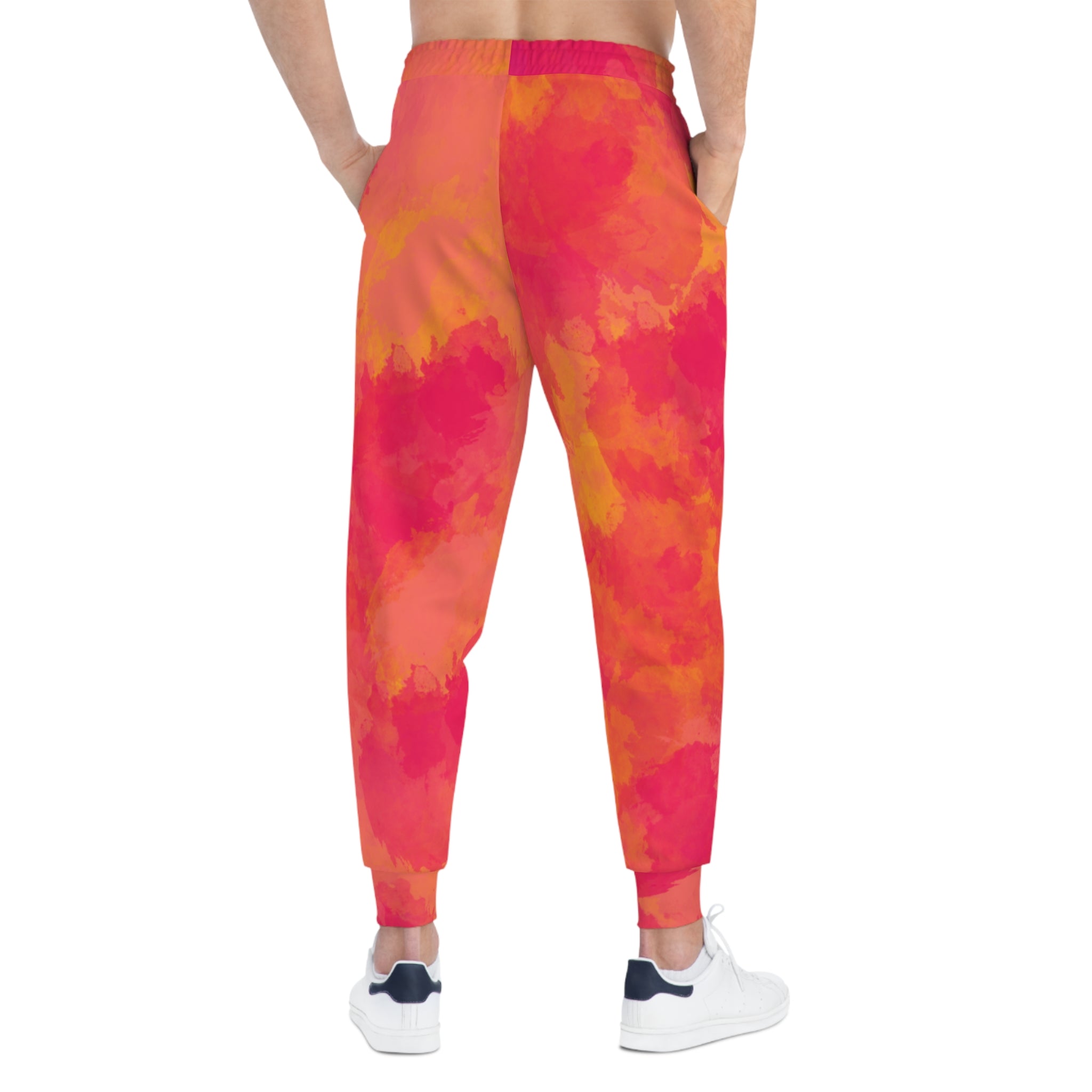 Pink-orange tie-dye joggers from the back/side, elastic waistband and ankle cuffs