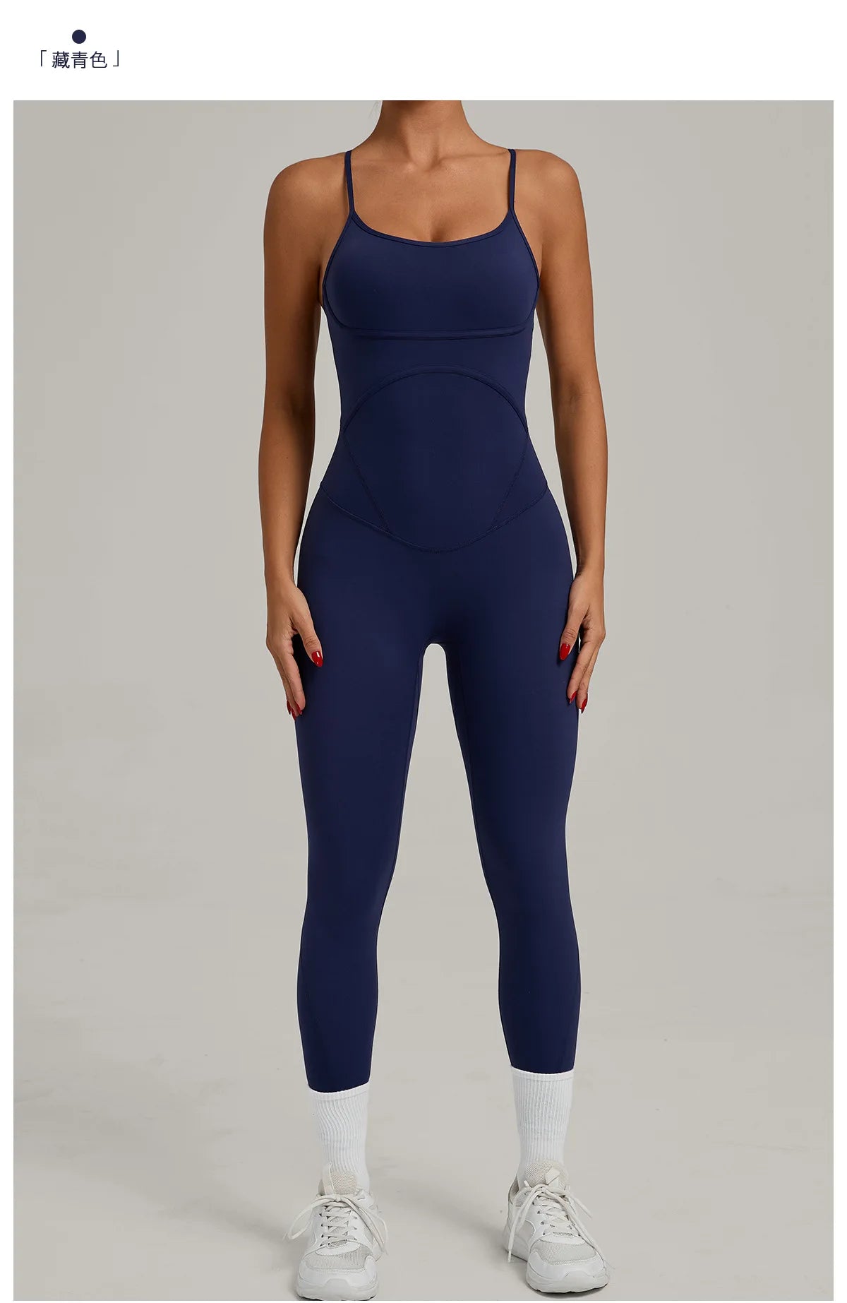Navy blue yoga jumpsuit with scoop neckline and long capri legs