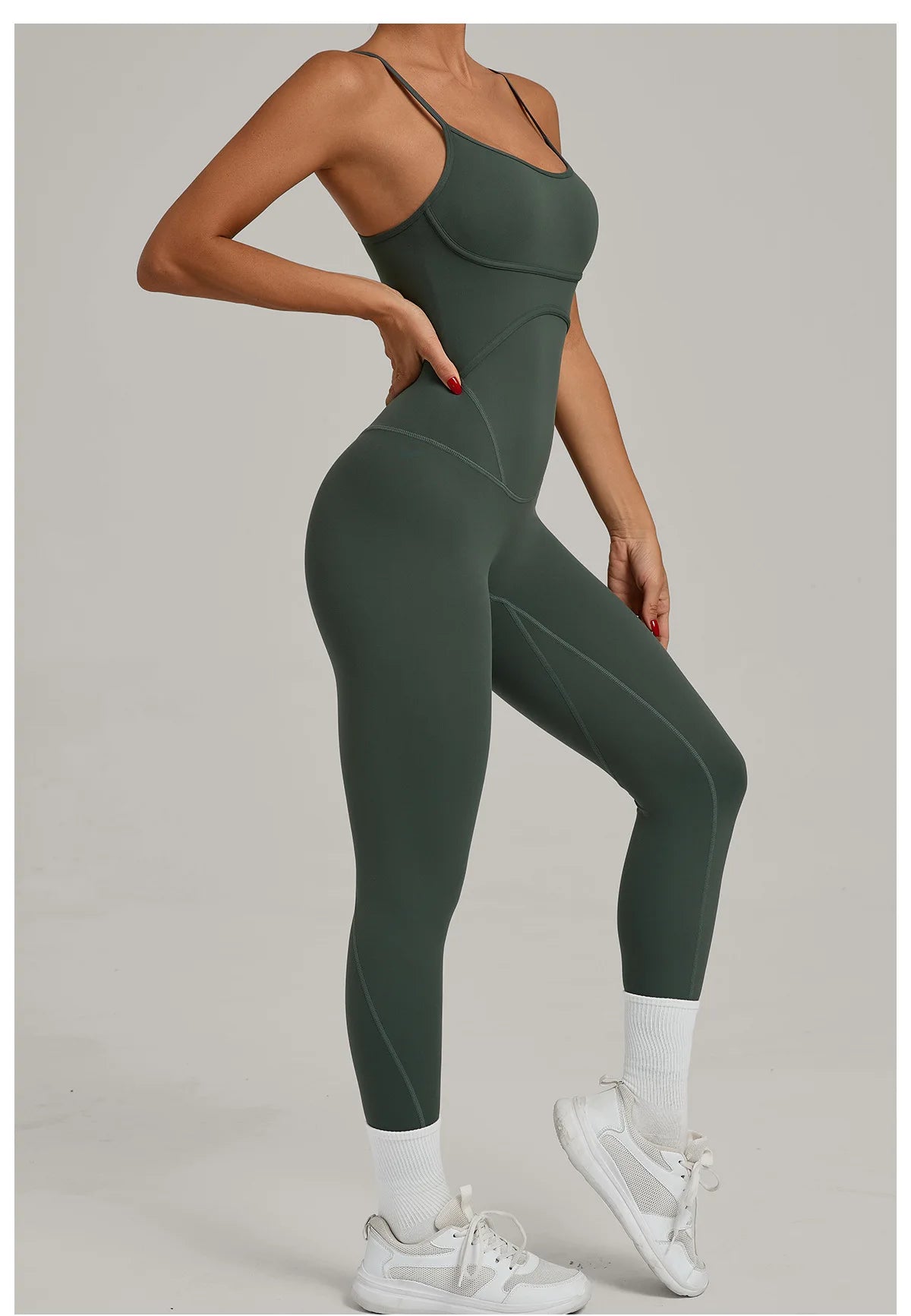 Women’s sleeveless yoga jumpsuit, fitted basil green, full-length with side seams