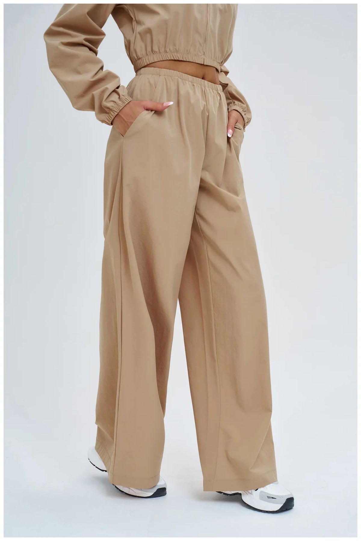 Xooie Fit Women's Beige Wide-Leg Trousers with Comfortable Pockets for Stylish Casual Wear