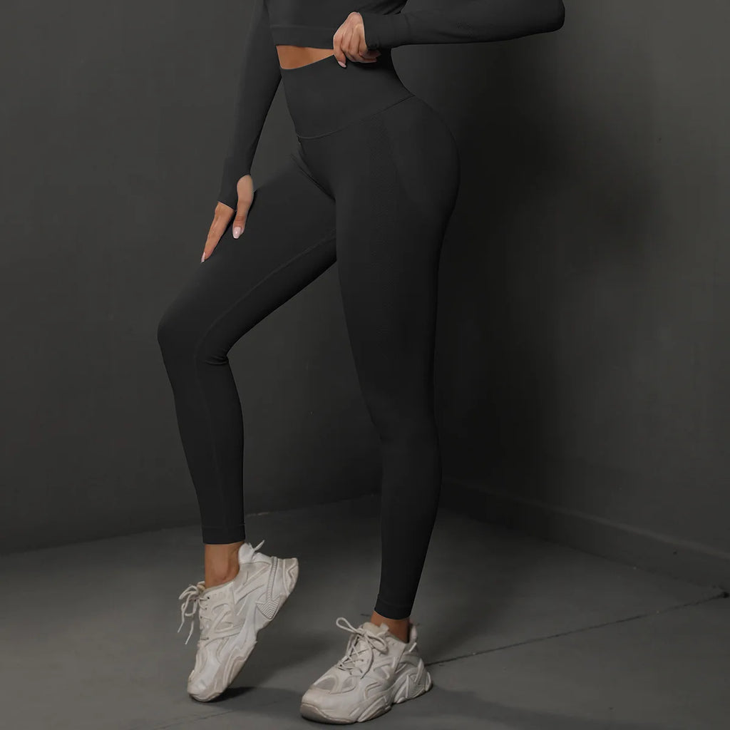 High-waist black yoga leggings, full-length, side view with fitted seams at the legs