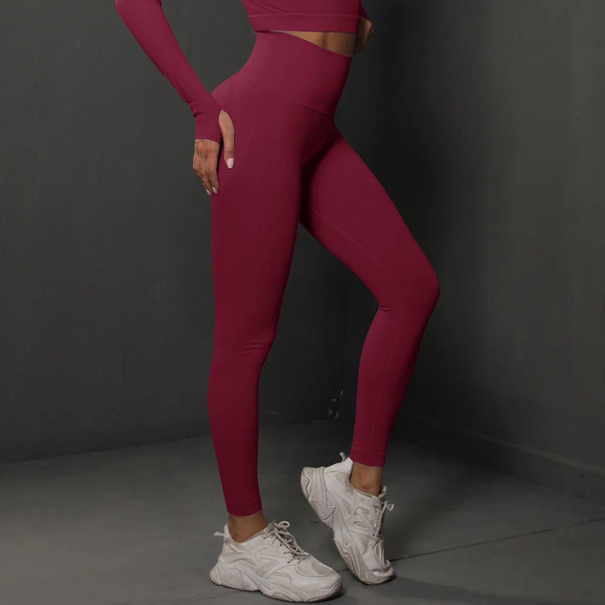 High-waist yoga leggings, deep wine red, side view with fitted tapered legs