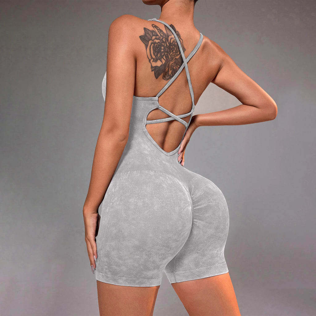 Washed gray strappy yoga unitard romper with crisscross back straps and short inseam
