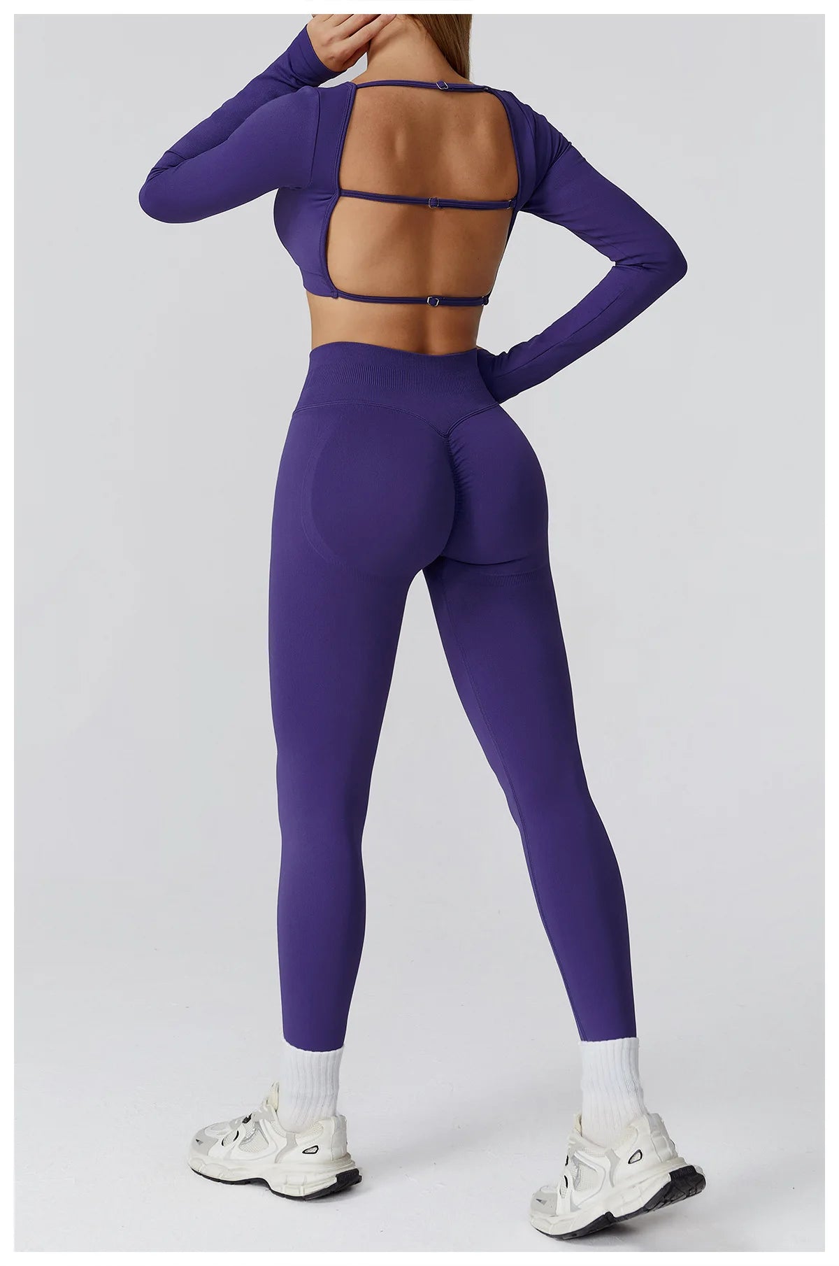 Xooie Fit long sleeve crop top and leggings set in purple with stylish back design for activewear enthusiasts