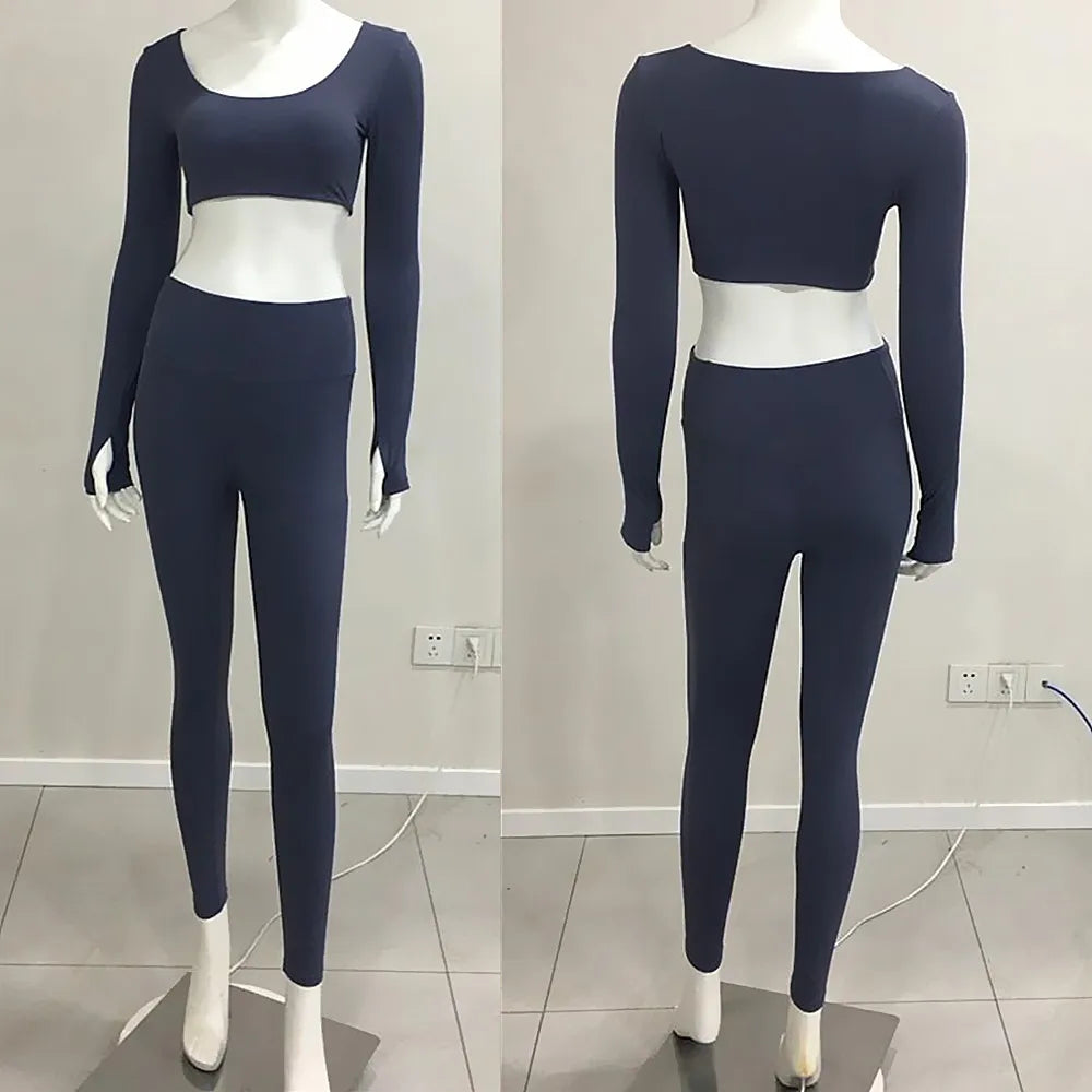 Xooie Fit long sleeve crop top with finger holes in navy, paired with matching leggings for a stylish look