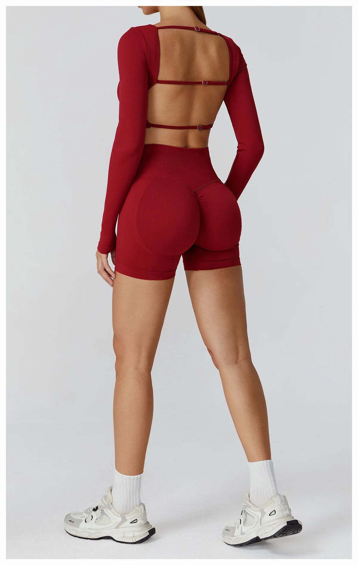 Xooie Fit two-piece set featuring a long sleeve gym crop top and shorts in red for stylish workouts