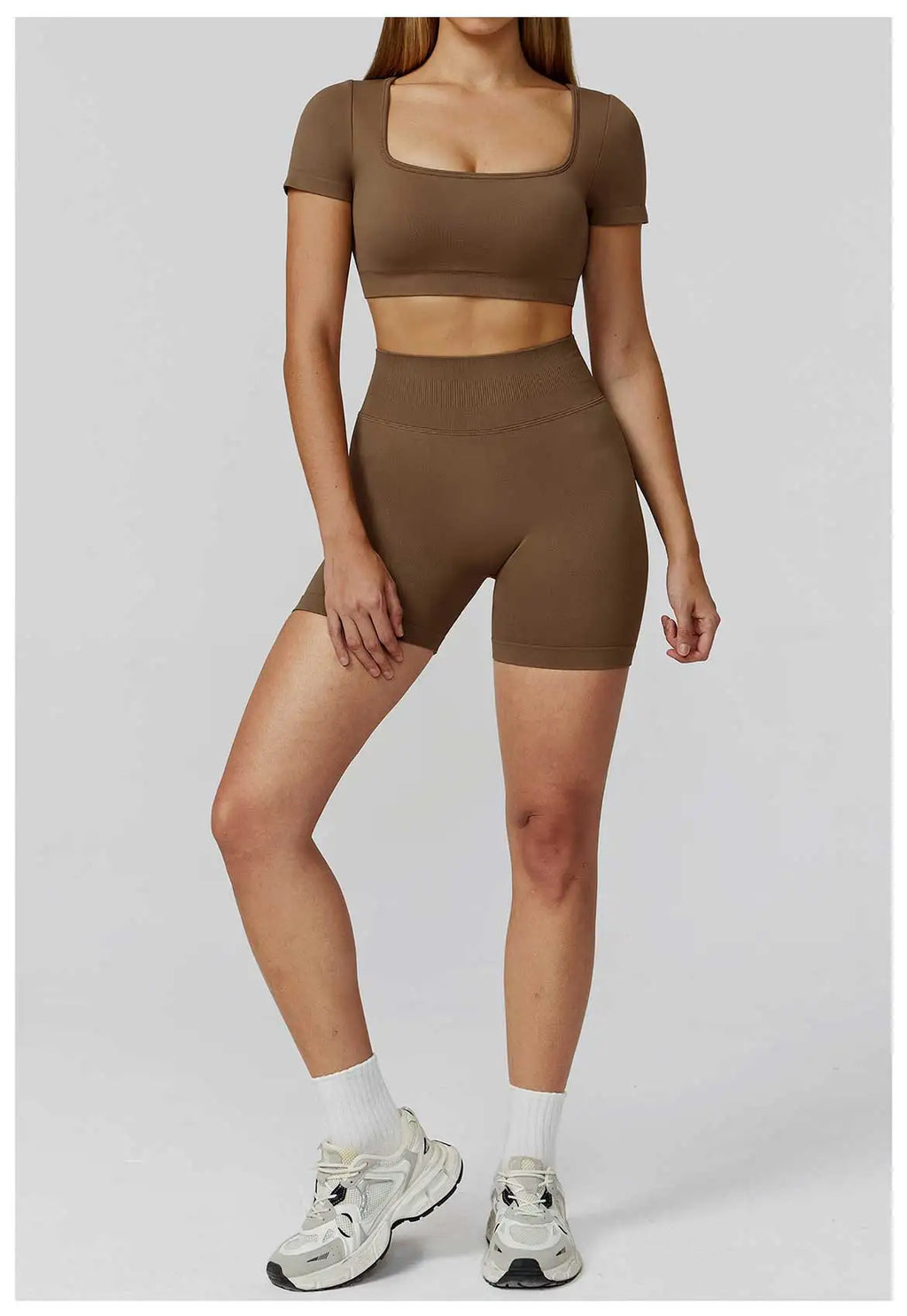 Xooie Fit Two-Piece Set featuring a long sleeve gym crop top and shorts in brown