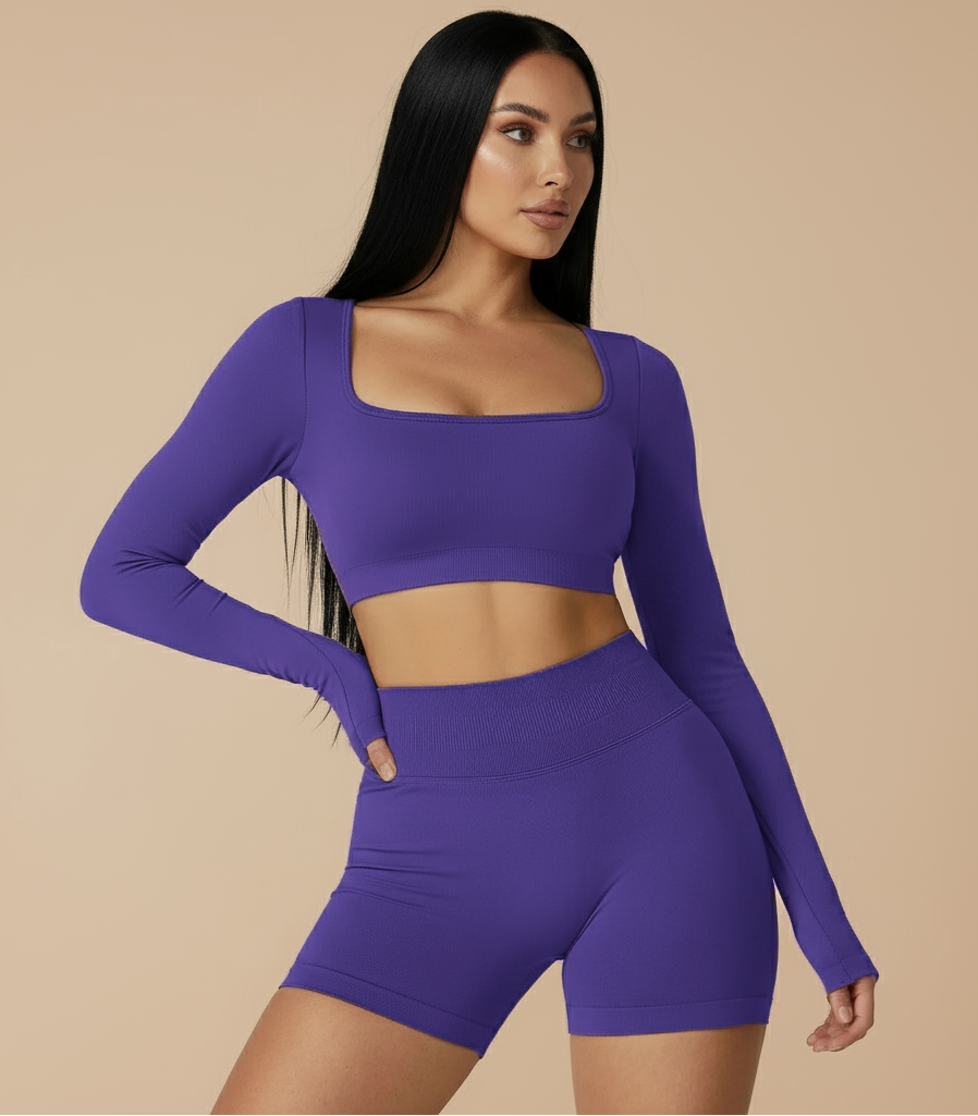 Xooie Fit two-piece set featuring a long sleeve gym crop top and shorts in vibrant purple color