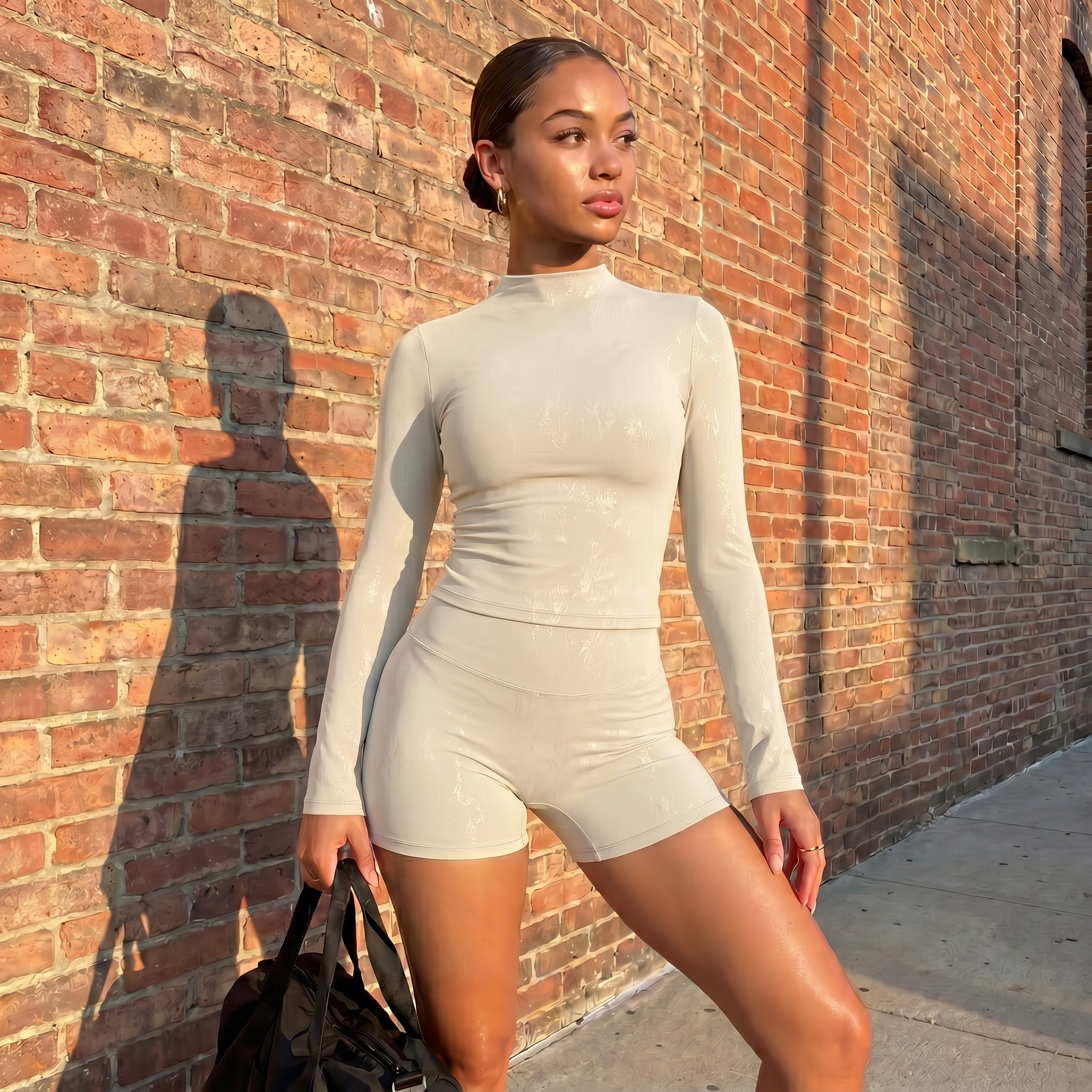 Light ivory textured long-sleeve fitted top and matching high-waist shorts set