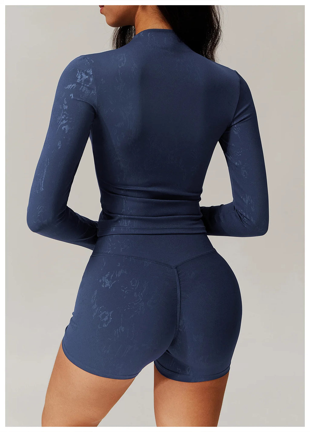 Embossed active matching set, textured navy fitted long sleeve top and shorts, back view