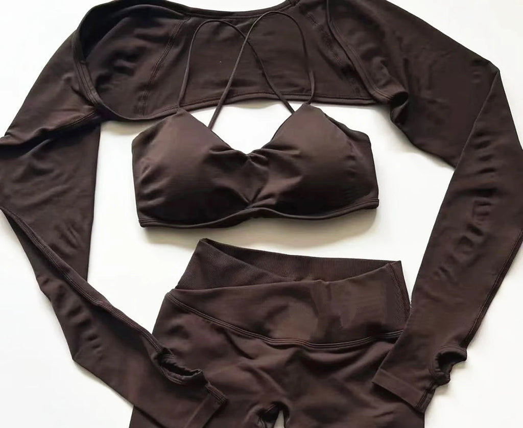 Xooie Fit long sleeve workout set with thumb holes in dark brown featuring a crop top and high-waisted leggings