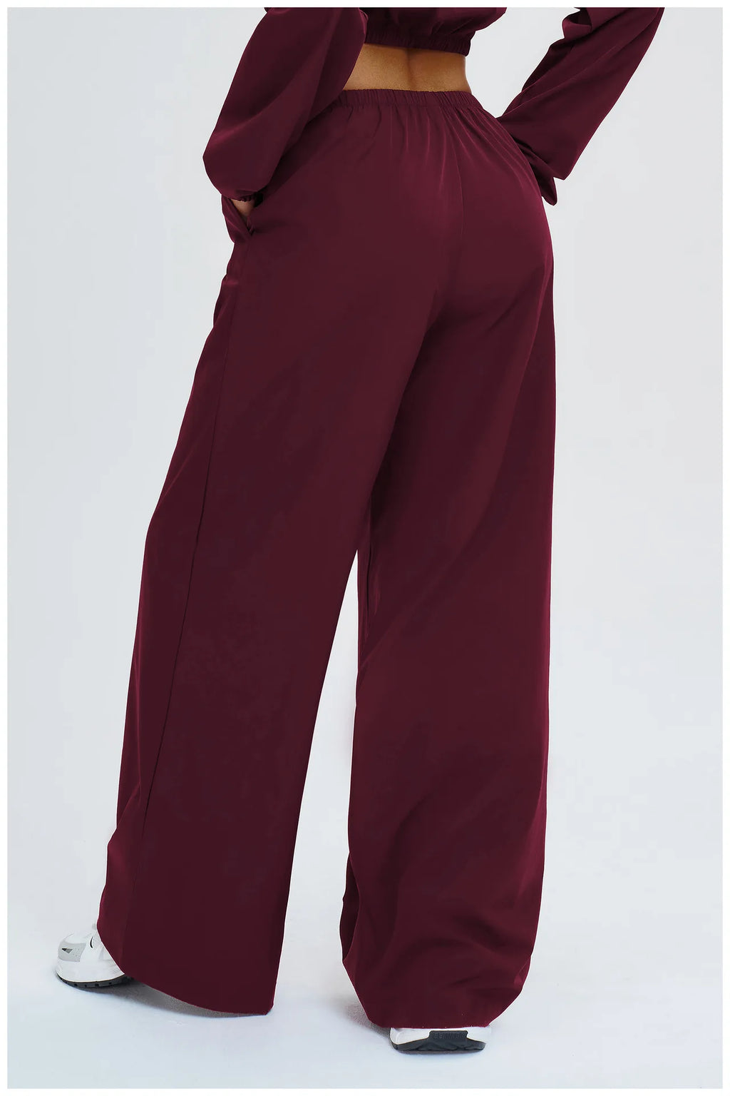 Burgundy wide-leg pants with elastic waistband, roomy straight silhouette