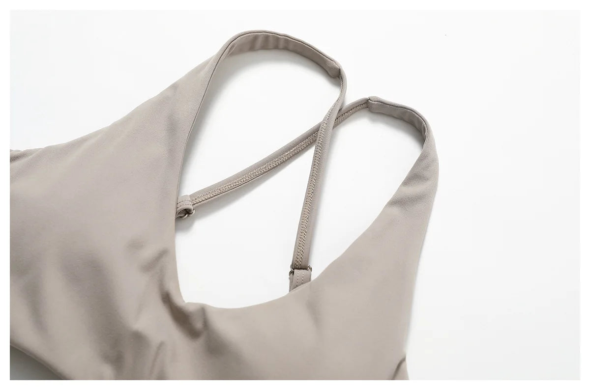 Close-up of beige strappy top from matching workout set for running by Xooie Fit