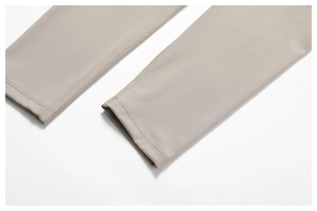 Close-up of a neutral-toned pants from a matching workout set for running by Xooie Fit