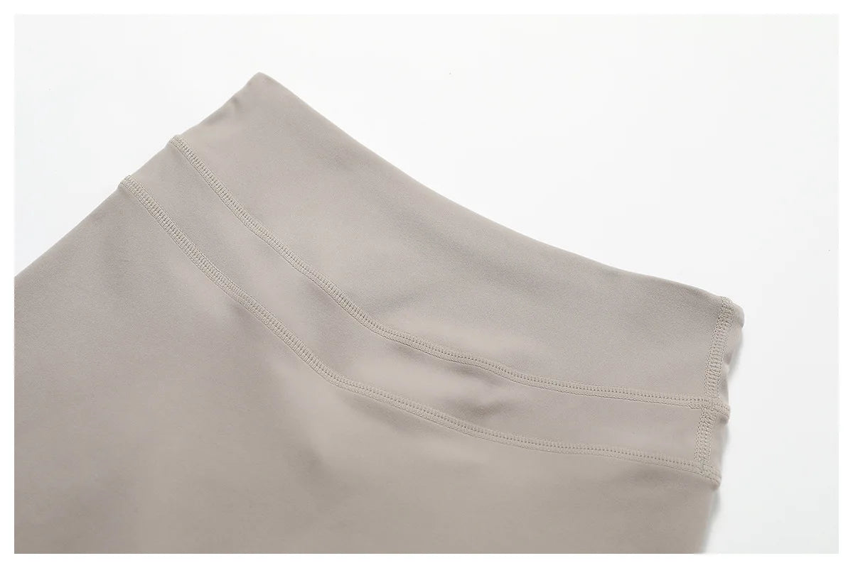 Close-up of a neutral-toned waistband from a matching workout set for running by Xooie Fit