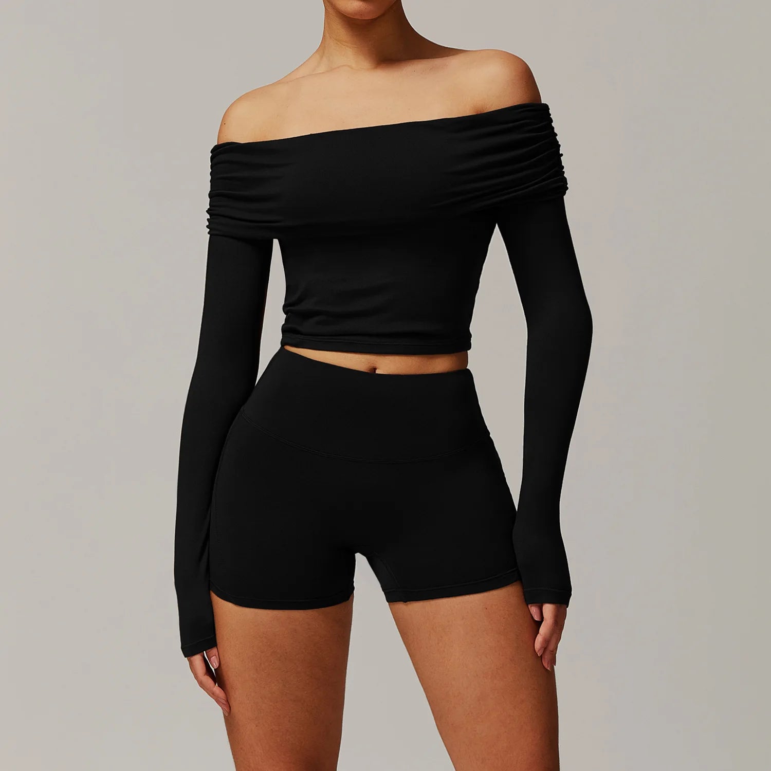 Xooie Fit black two-piece off shoulder workout set with long sleeves and high-waisted shorts