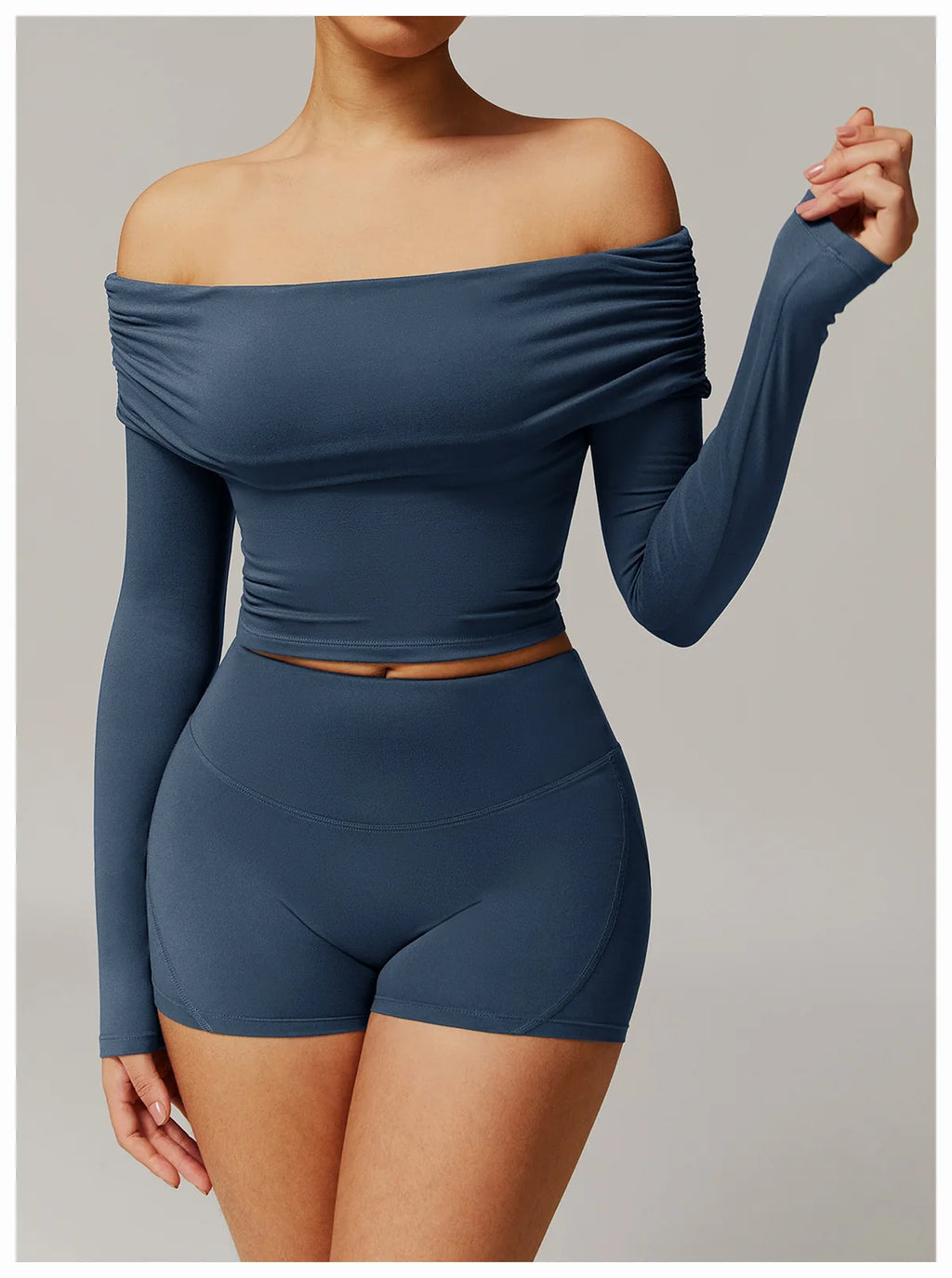 Xooie Fit off shoulder workout set featuring long sleeve crop top and matching high-waisted shorts in blue