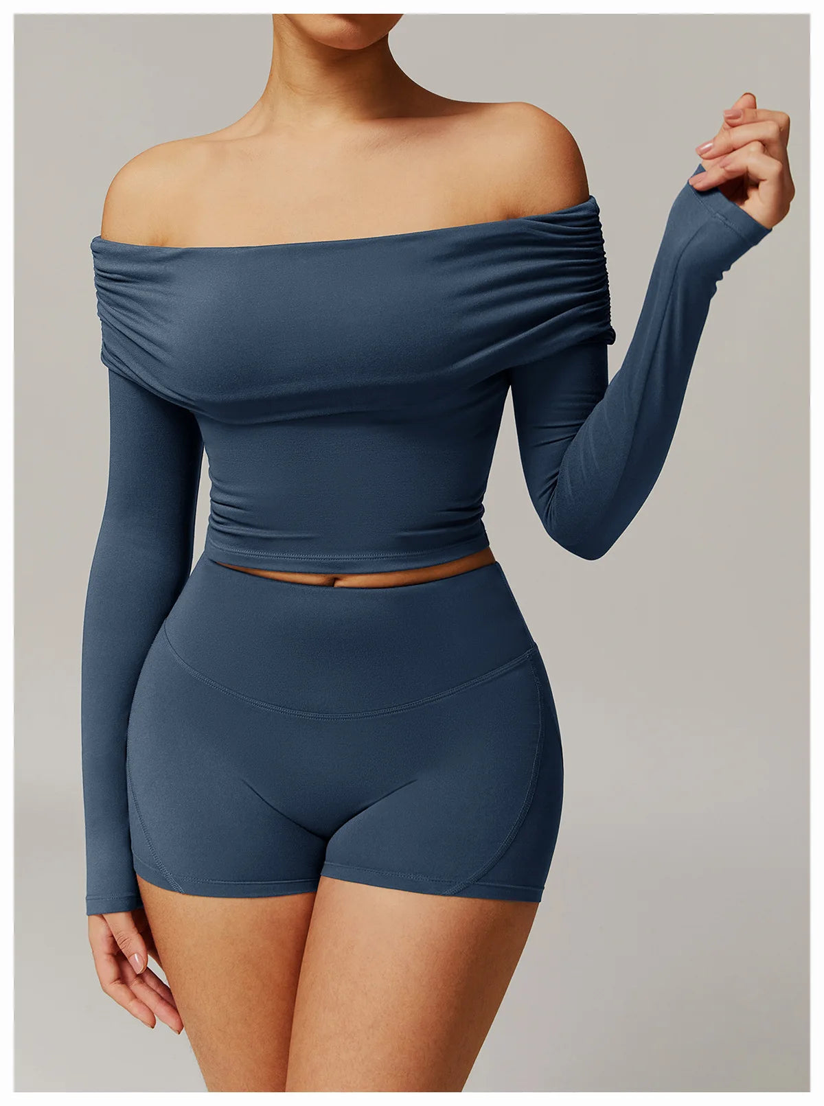 Xooie Fit off shoulder workout set featuring long sleeve crop top and matching high-waisted shorts in blue