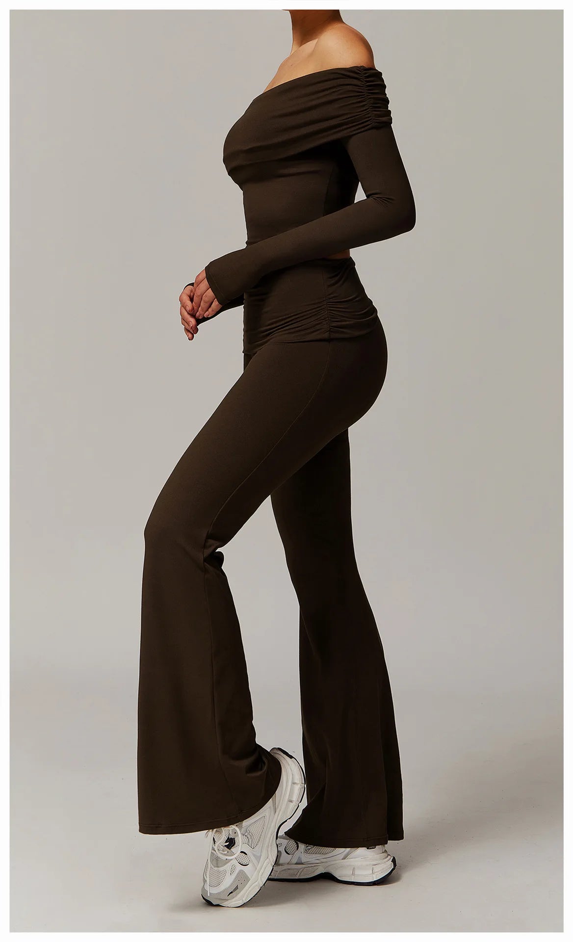 Xooie Fit off the shoulder flare pant yoga set in brown worn with white sneakers