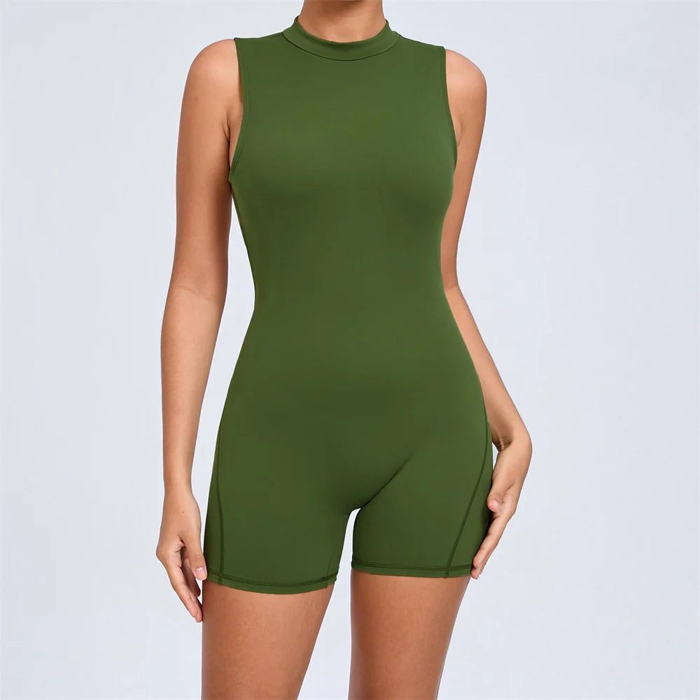 Xooie Fit open-back romper for workouts in green, featuring a sleek sleeveless design.