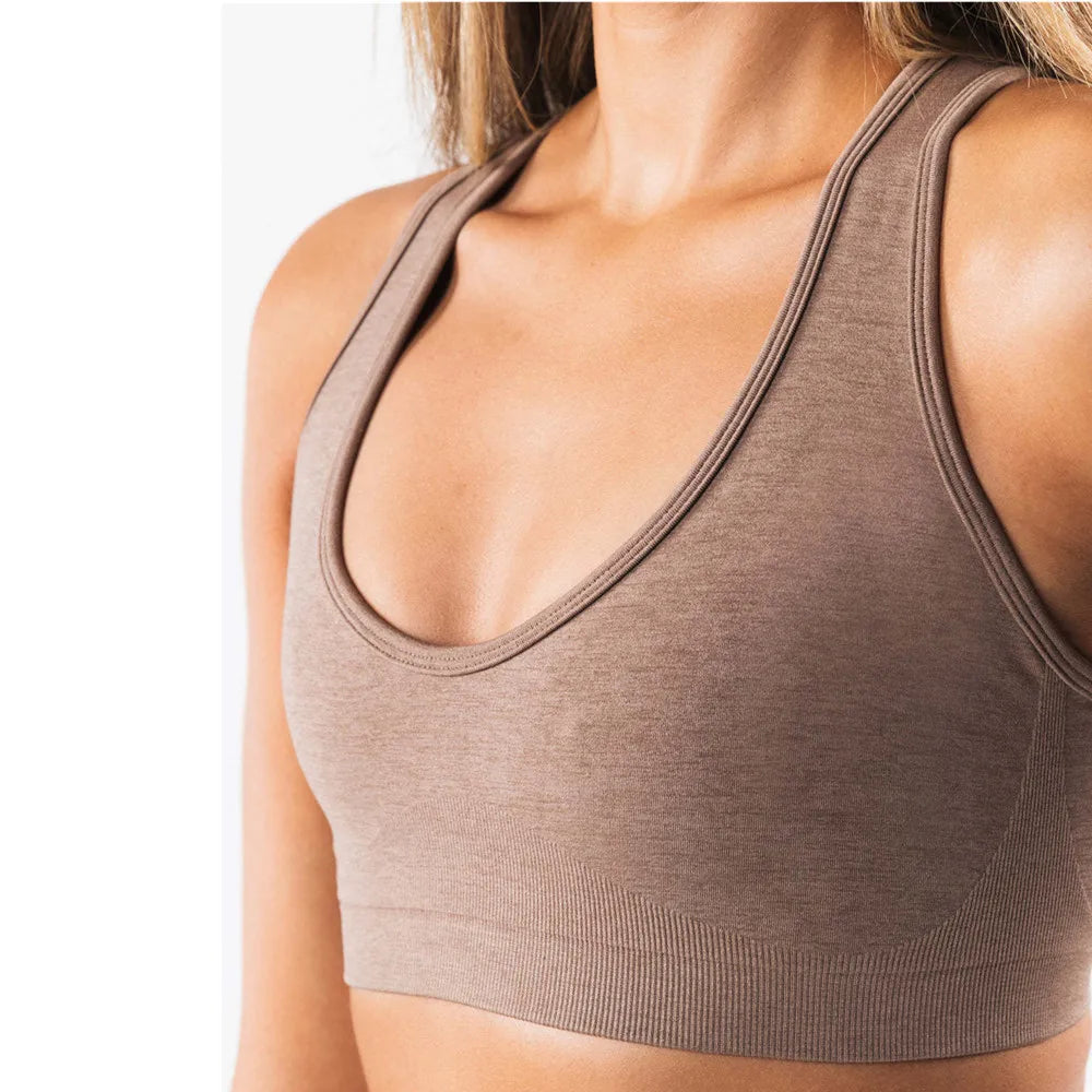 Xooie Fit open-back workout bra in taupe, designed for comfort and flexibility during exercise