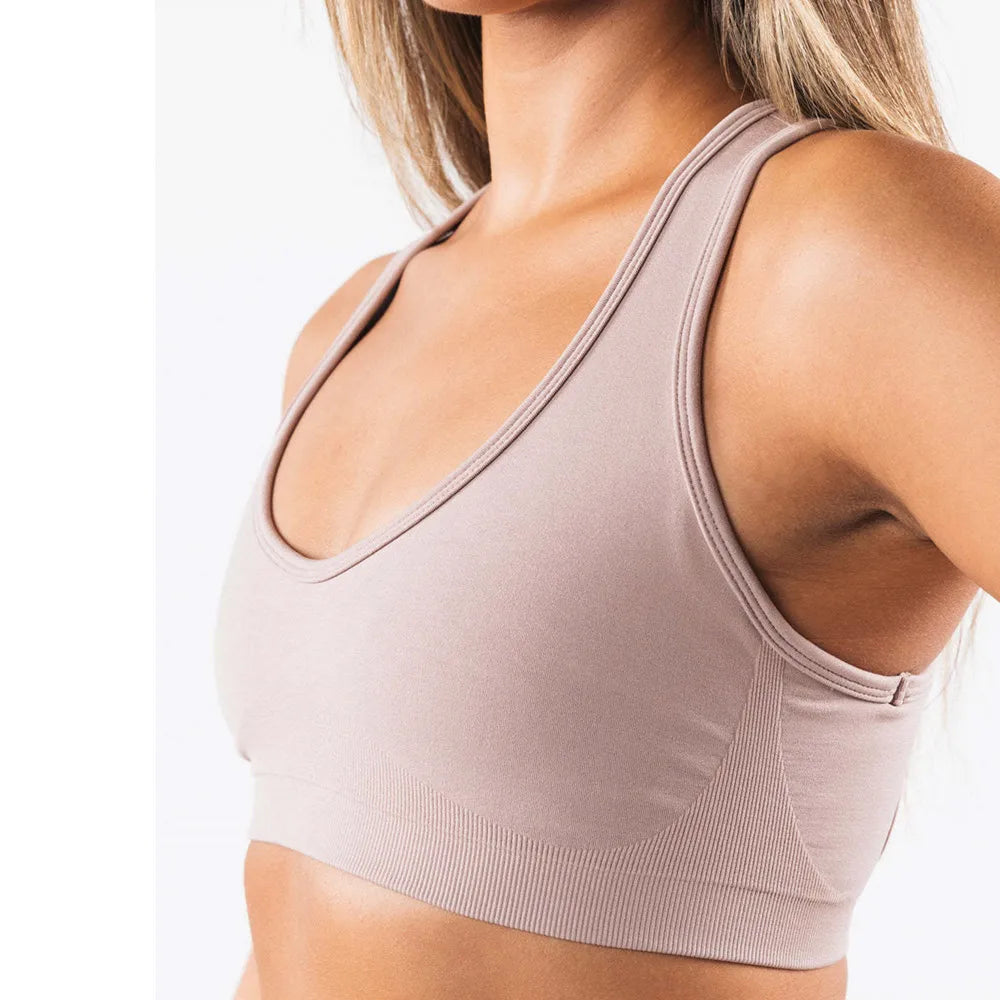 Xooie Fit open-back workout bra in soft beige for comfort and support during exercise