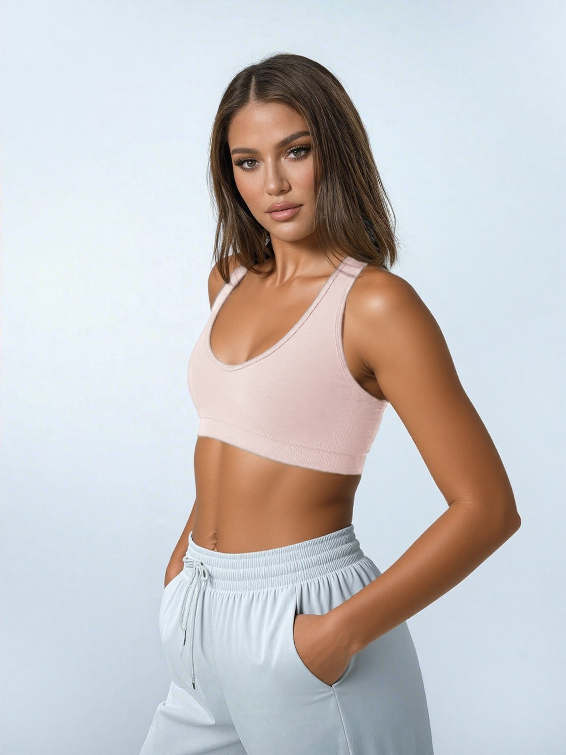 Xooie Fit open-back workout bra in soft pink for comfort during fitness activities