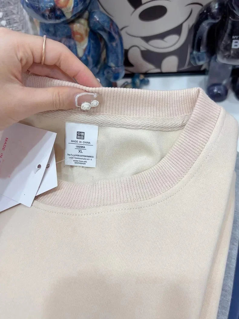 Xooie Fit oversized fleece sweatshirt for women in light beige with tag detail and soft fabric
